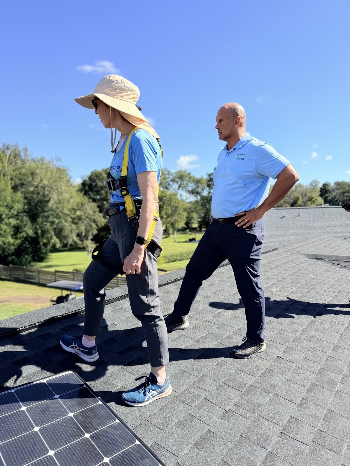 Congresswoman Gwen Graham and Steve Rutherford on a Tampa Bay Solar rooftop installation